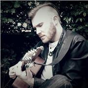 A friendly and dedicated guitar tutor with experience in a wide variety of styles such as rock, funk, blues, metal, classical and jazz.